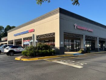 A photo of the exterior of the Peachtree Immediate Care location in Lawrenceville on a sunny day.