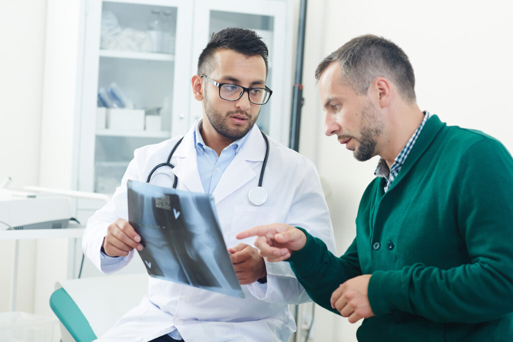 Doctor and patient looking at X-ray image