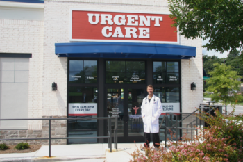 Photo of the doctor at the front door of the Peachtree Immediate Care in Dunwoody